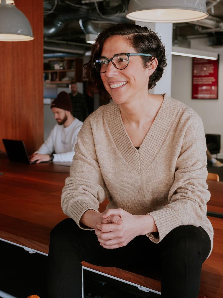 Carmen López sitting in an office environment