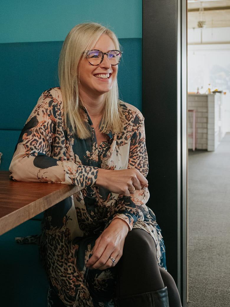 Zoë Turner sitting in an office environment