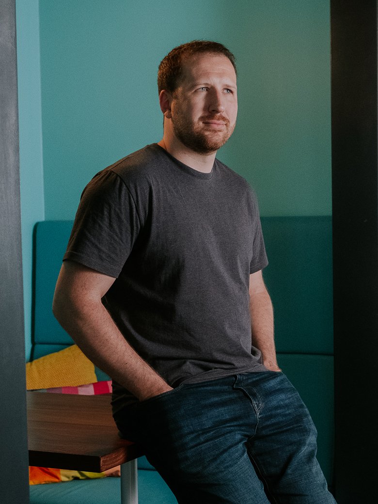 Dean Oakes sitting in an office environment