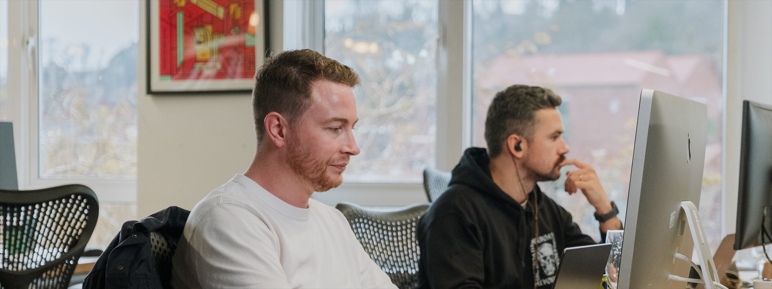 Two developers working in an office setting