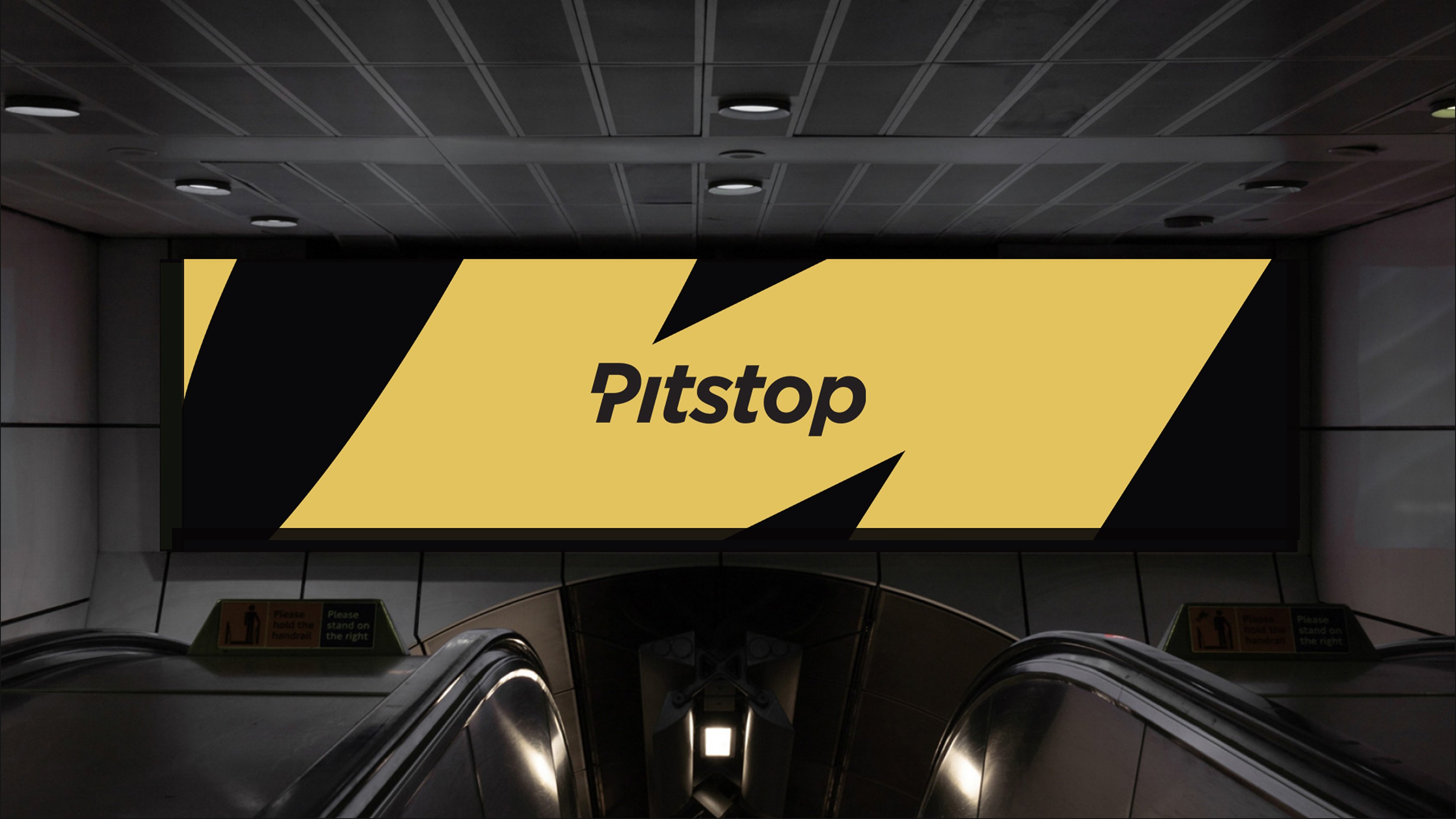 Large yellow-and-black Pitstop advertisement displayed above an escalator in an underground station.