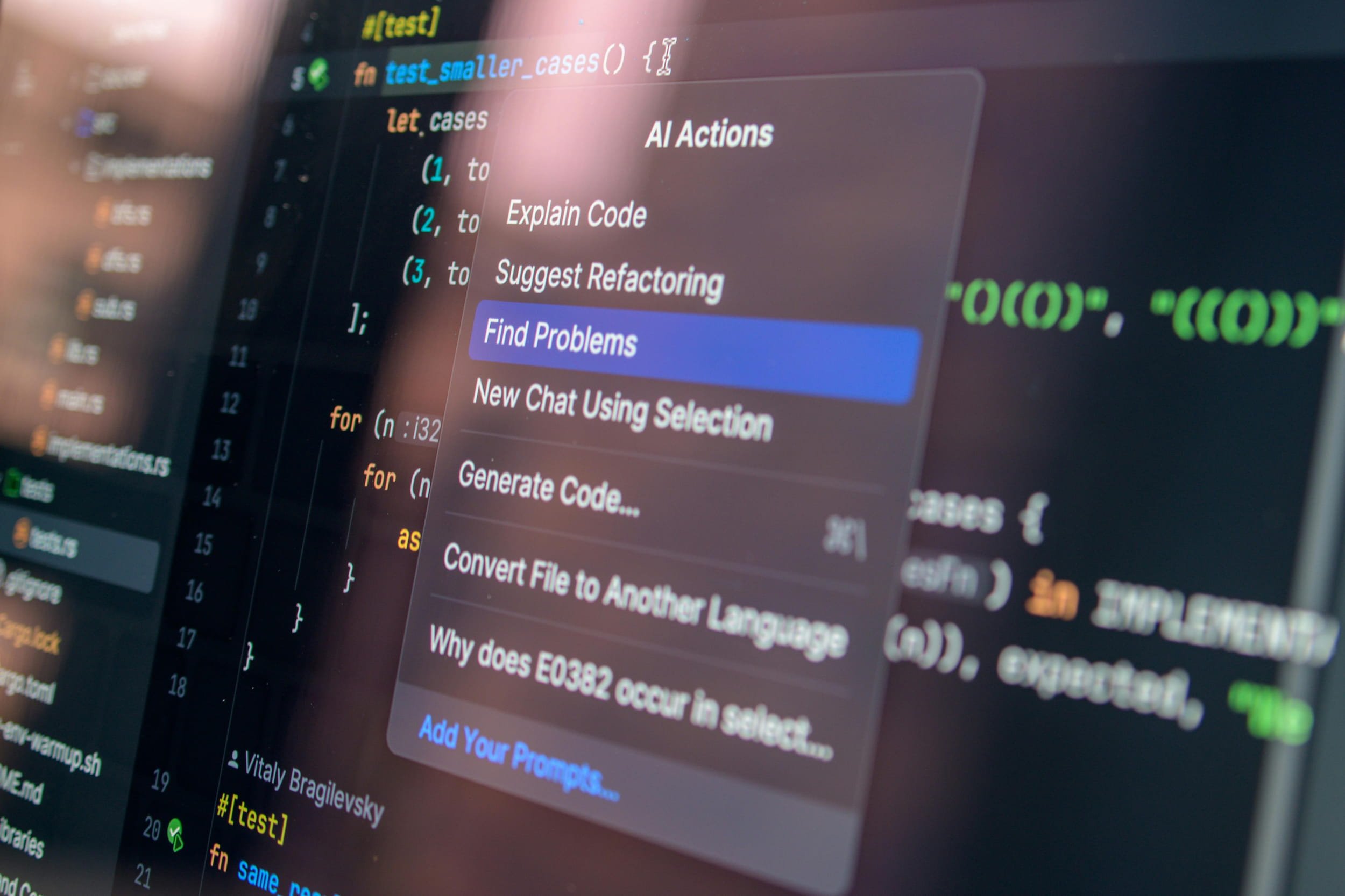 A close up shot of a computer screen showing a menu with AI-assisted scanning for code problems highlighted as an action