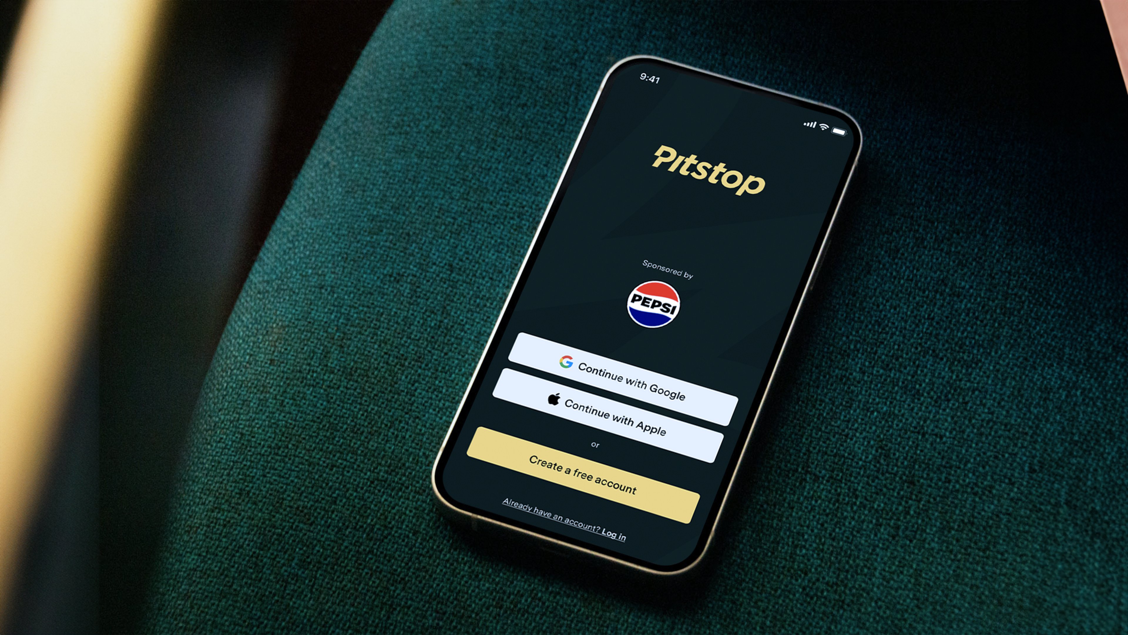 Mobile app open on phone sat on a car seat