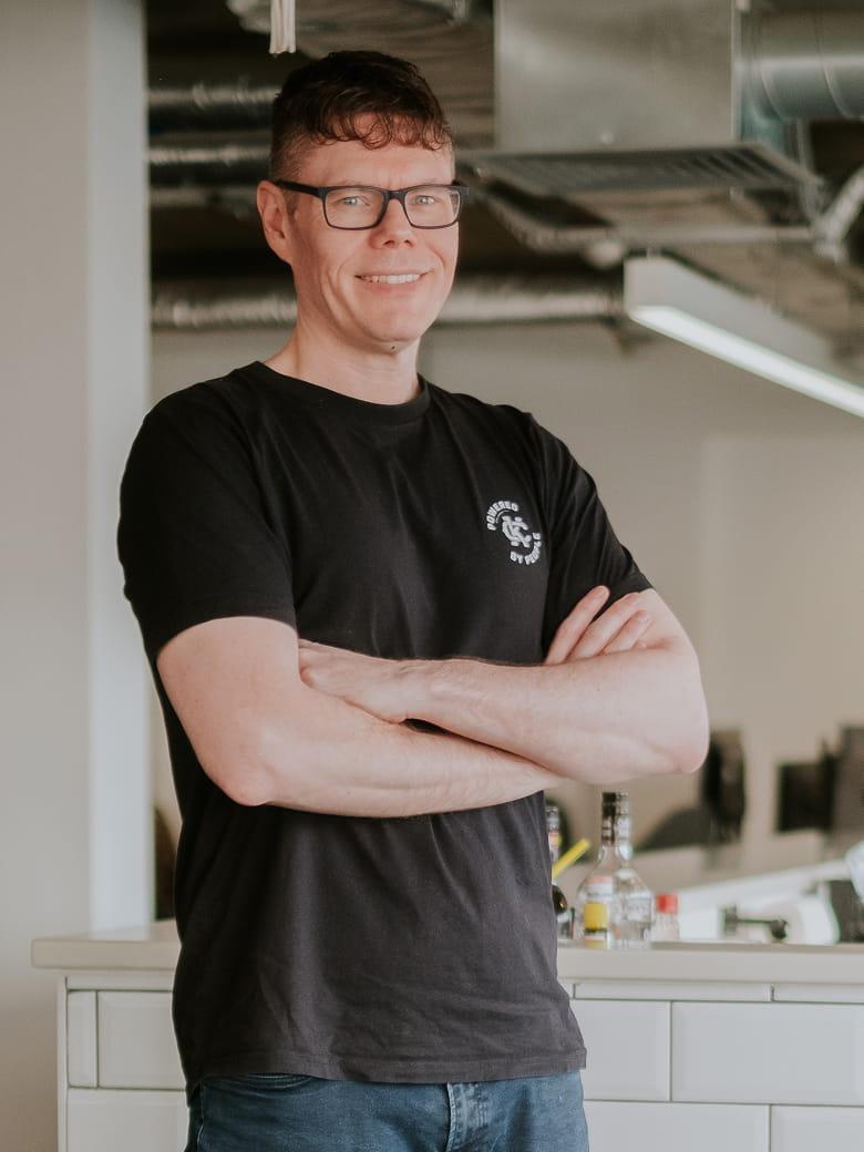 Andy Pike sitting in an office environment