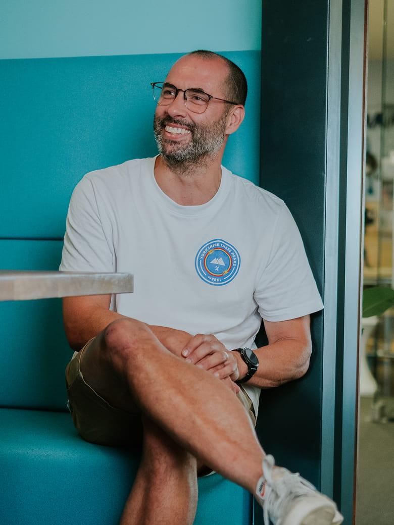 Chris Cannacott sitting in an office environment