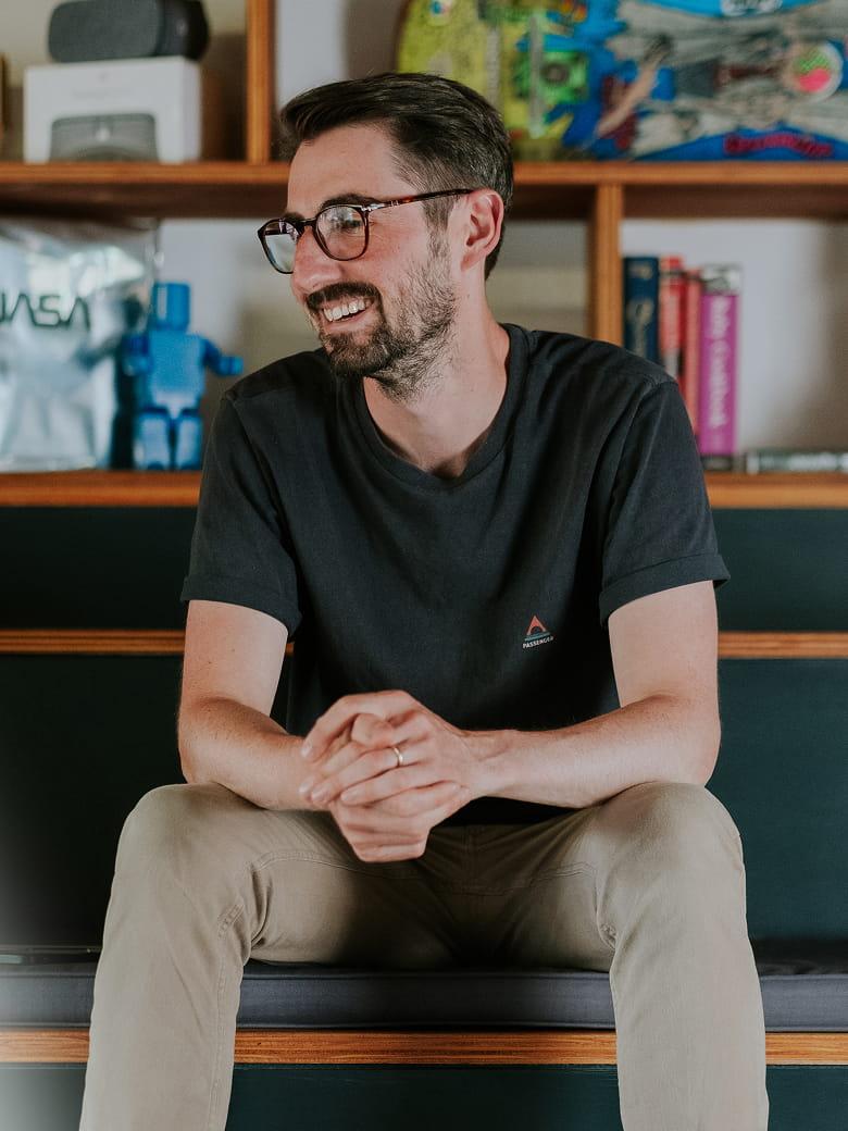 Chris Myers sitting in an office environment
