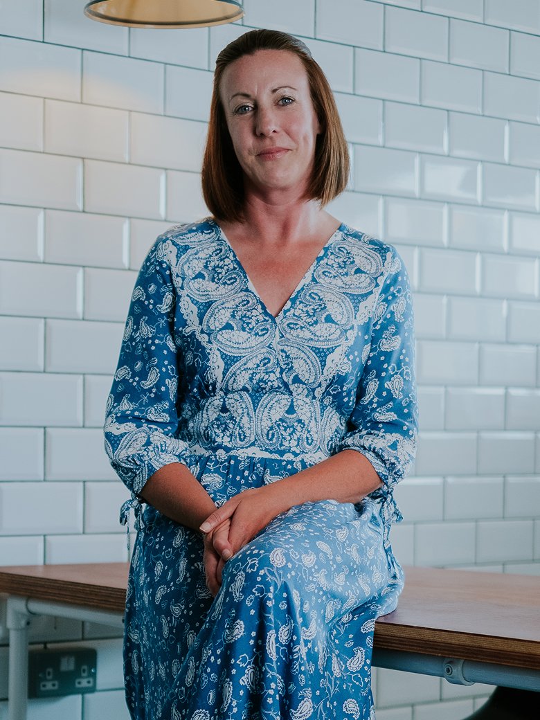 Claire Chase sitting in an office environment