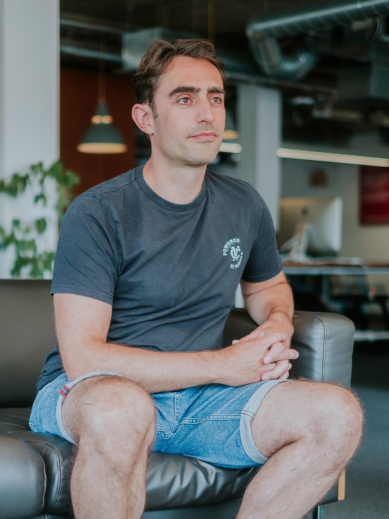 David Cocks sitting in an office environment