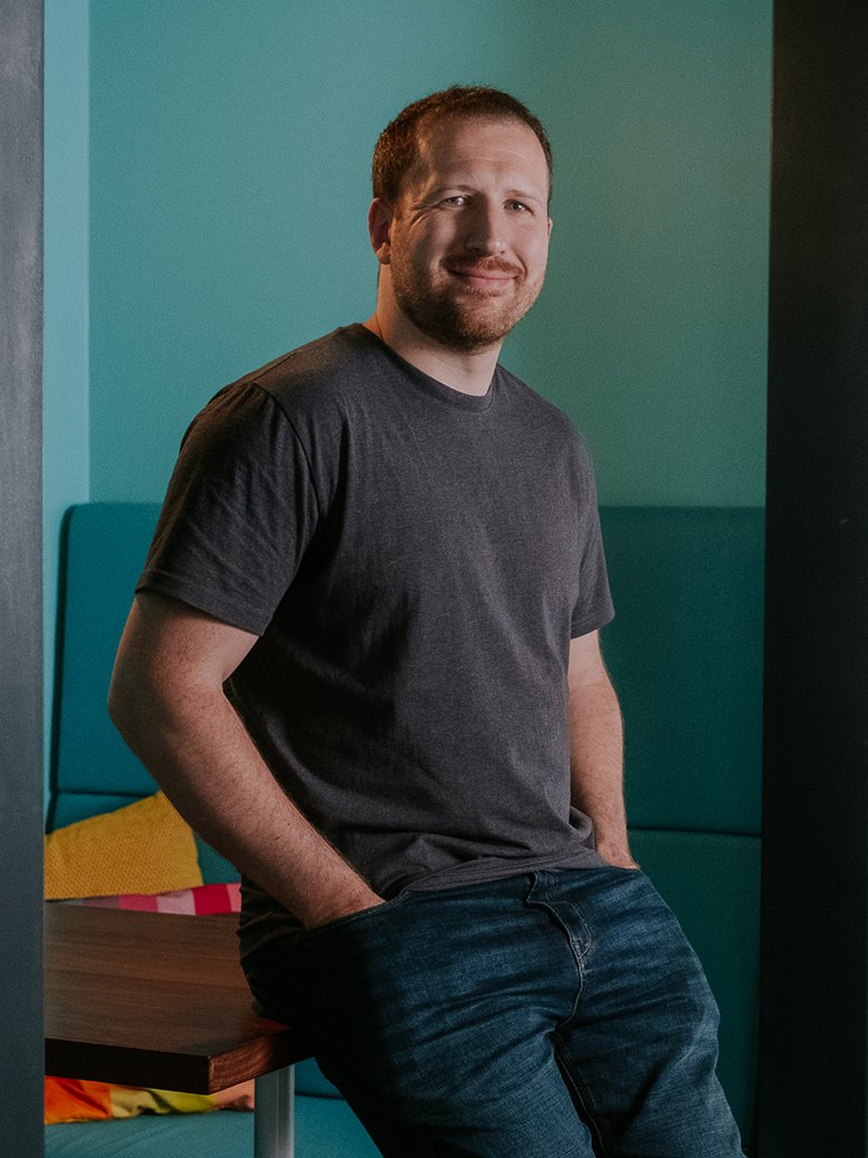 Dean Oakes sitting in an office environment