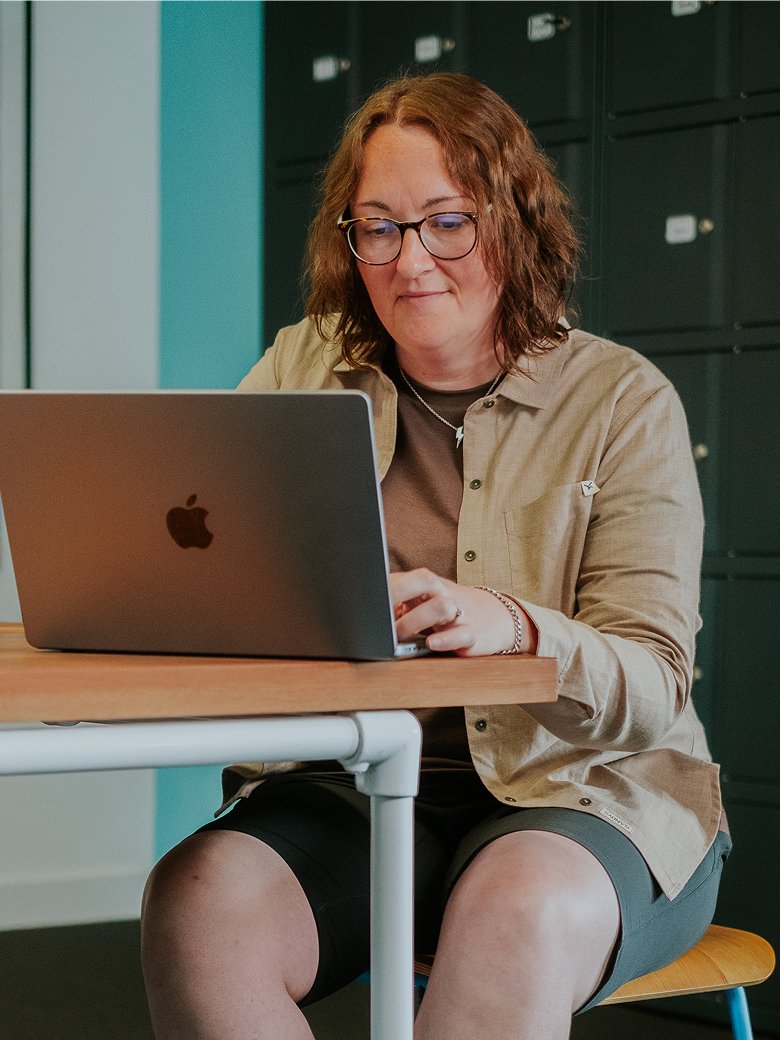 Helen McCarthy sitting in an office environment
