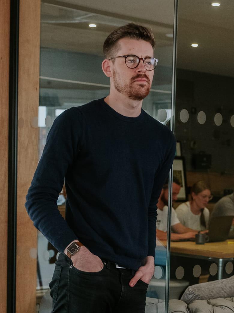 Henry Price sitting in an office environment