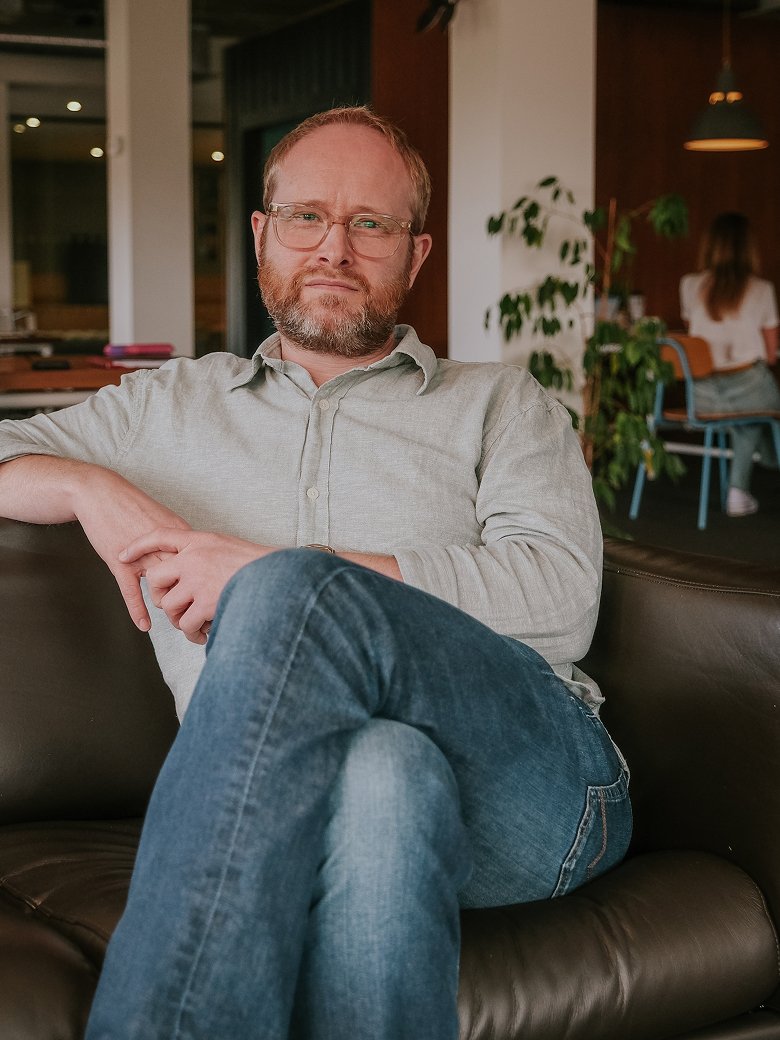 James Pryce sitting in an office environment