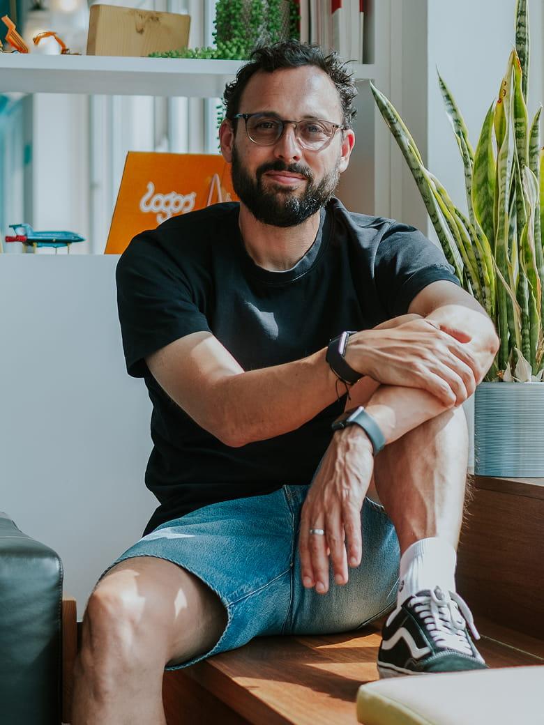 Laurent Maguire sitting in an office environment