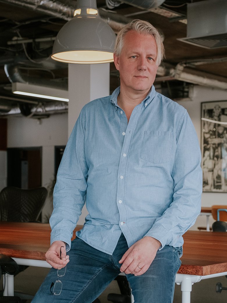 Piers Palmer sitting in an office environment