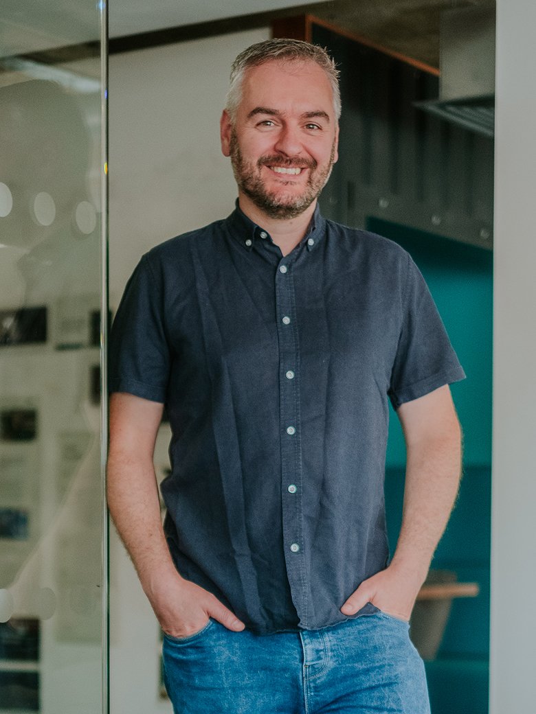 Robin Marsden sitting in an office environment