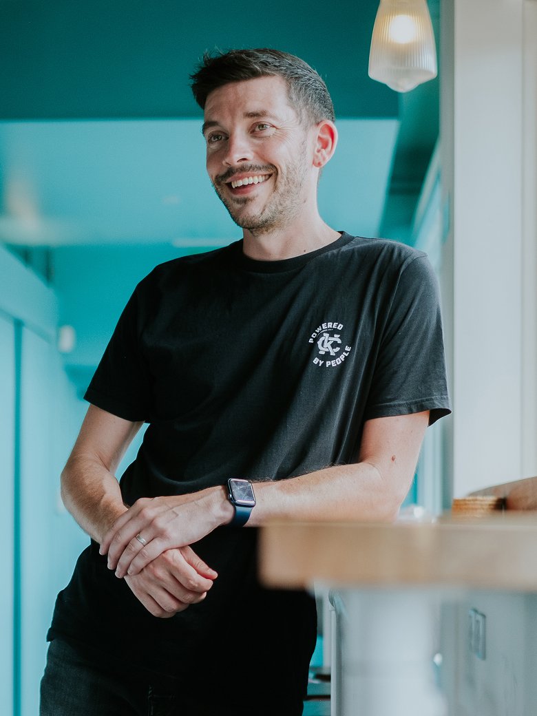 Simon Hardy sitting in an office environment